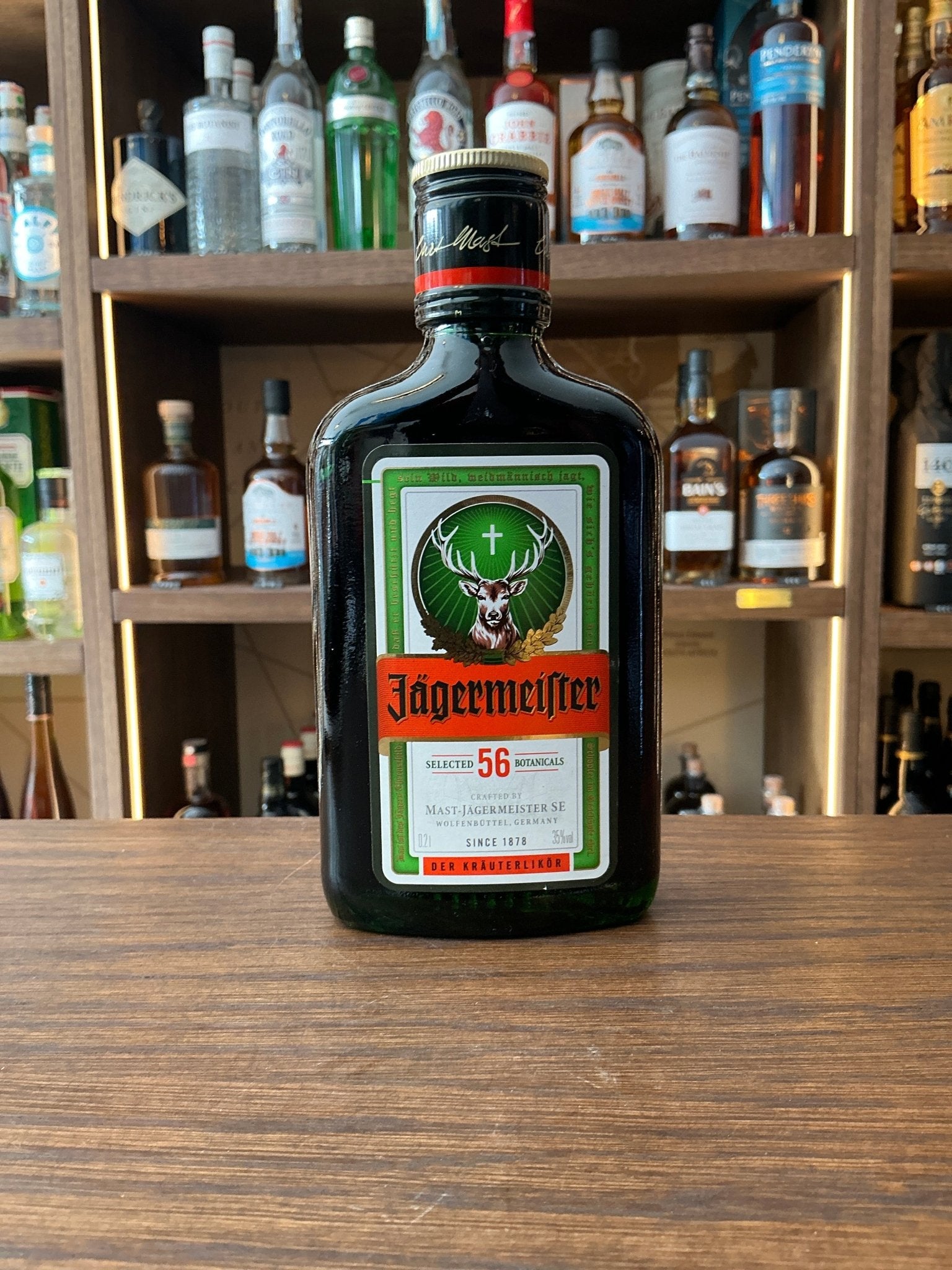 Jägermeister 20cl herbal liqueur bottle with iconic green glass, orange label and stag logo, German herbal spirit 35% ABV