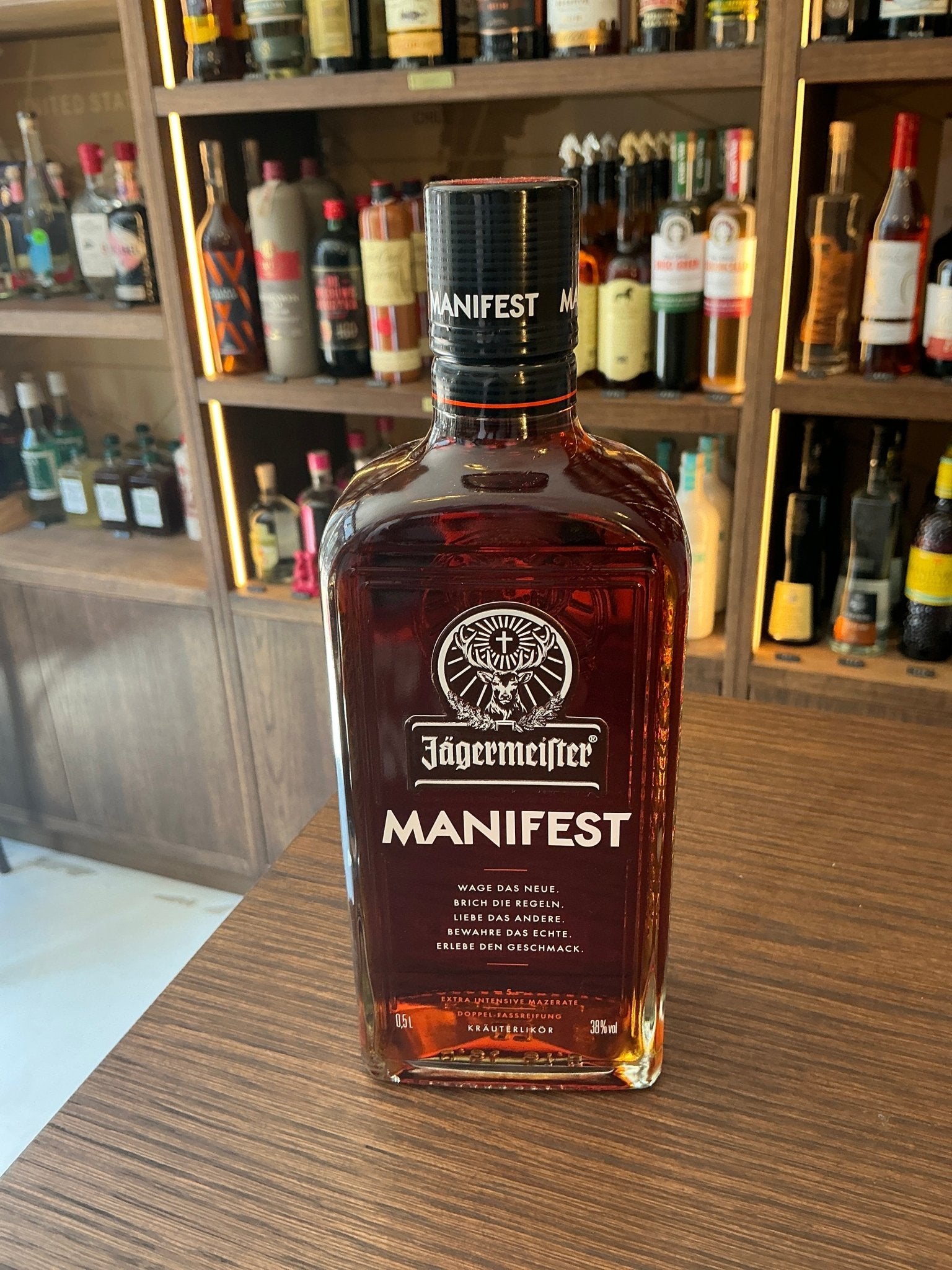 Jägermeister Manifest premium aged herbal liqueur bottle with distinctive label, oak-aged botanical spirit, 38% ABV