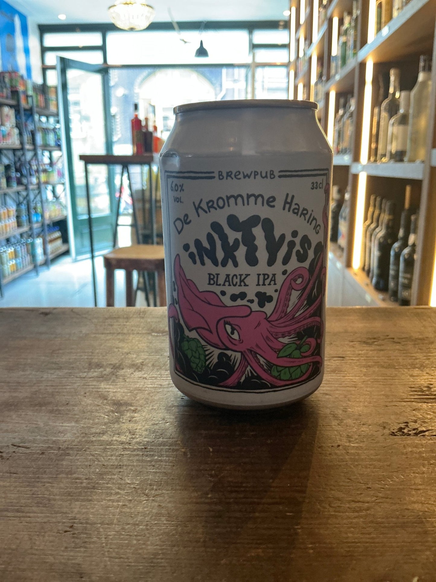Kromme Haring Inktvis Black IPA craft beer can with pink octopus illustration on white background, artisan Dutch specialty.