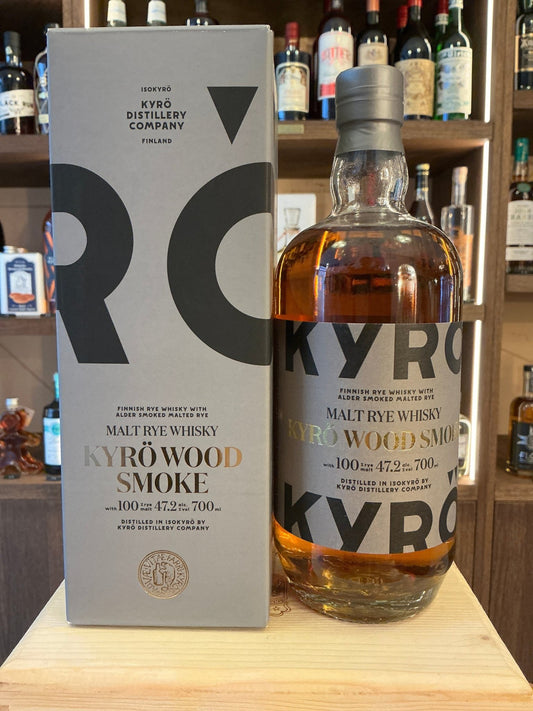 Kyro Wood Smoke Rye Whisky bottle with amber liquid, labeled premium small batch artisan rye whisky, spiced and aged, next.