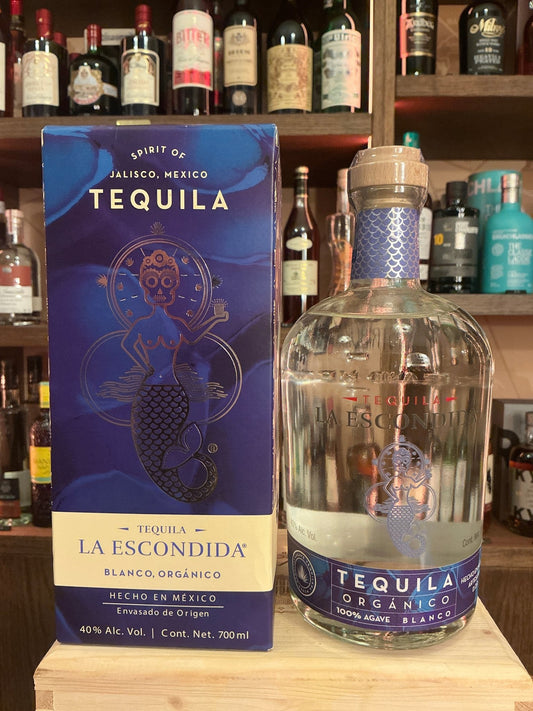 La Escondida Tequila Blanco bottle with clear glass and blue label beside matching blue box, premium artisan small batch.