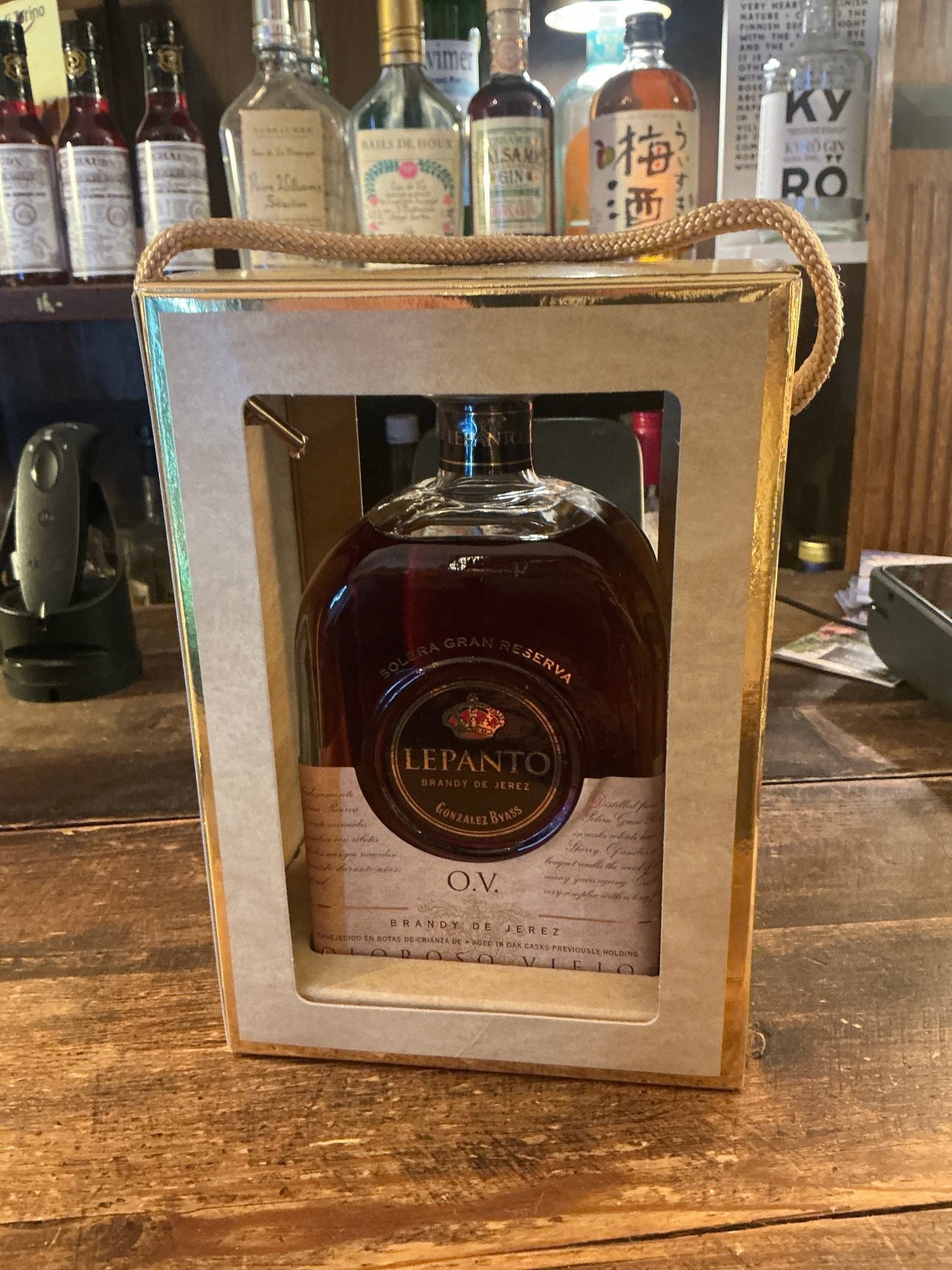 Lepanto XO brandy bottle with amber liquid inside wooden gift box, premium aged distilled Spanish brandy.