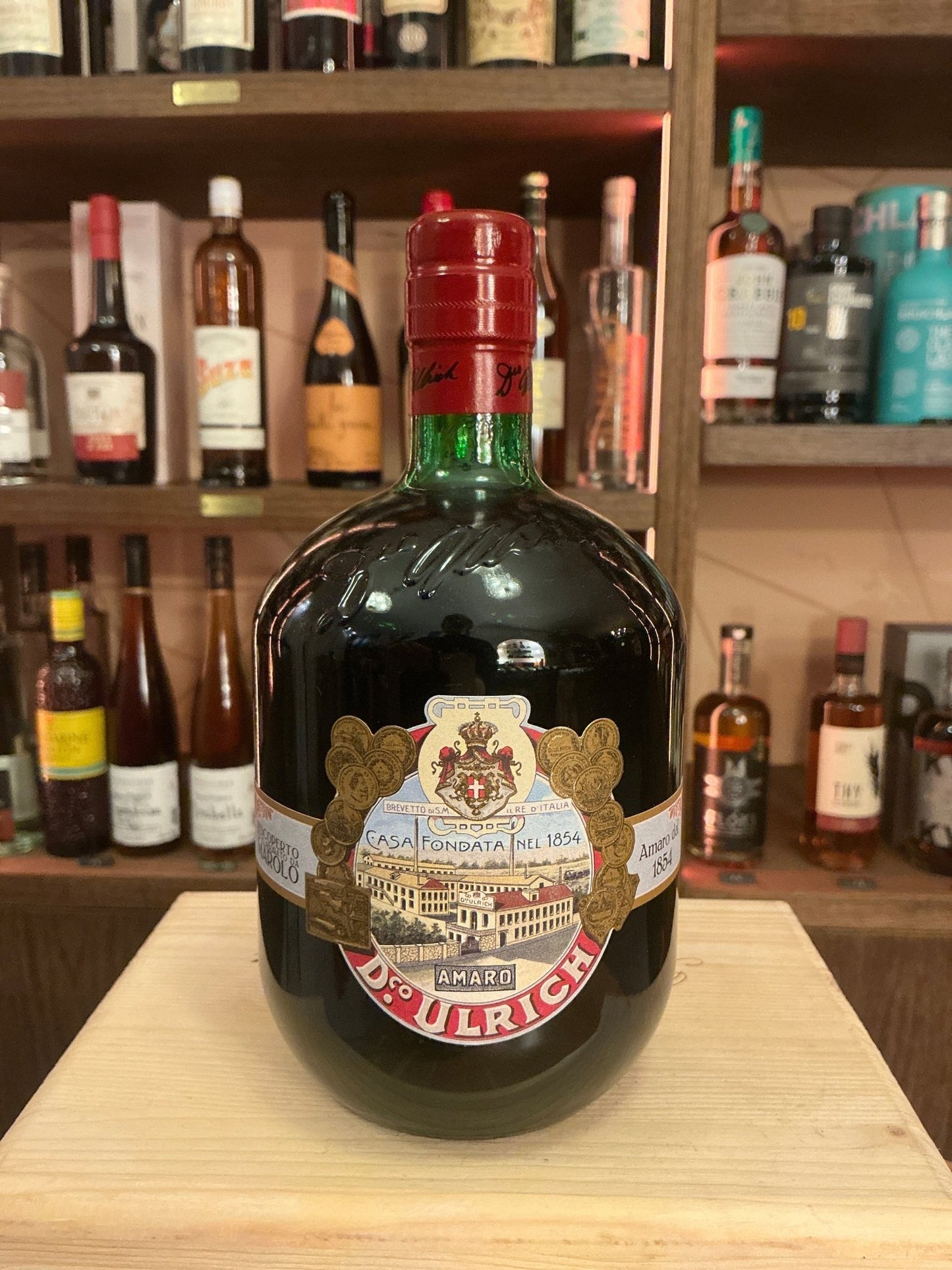 Marolo Amaro Ulrich premium artisanal botanical liqueur in dark green spiced bottle with red cap and vintage label.