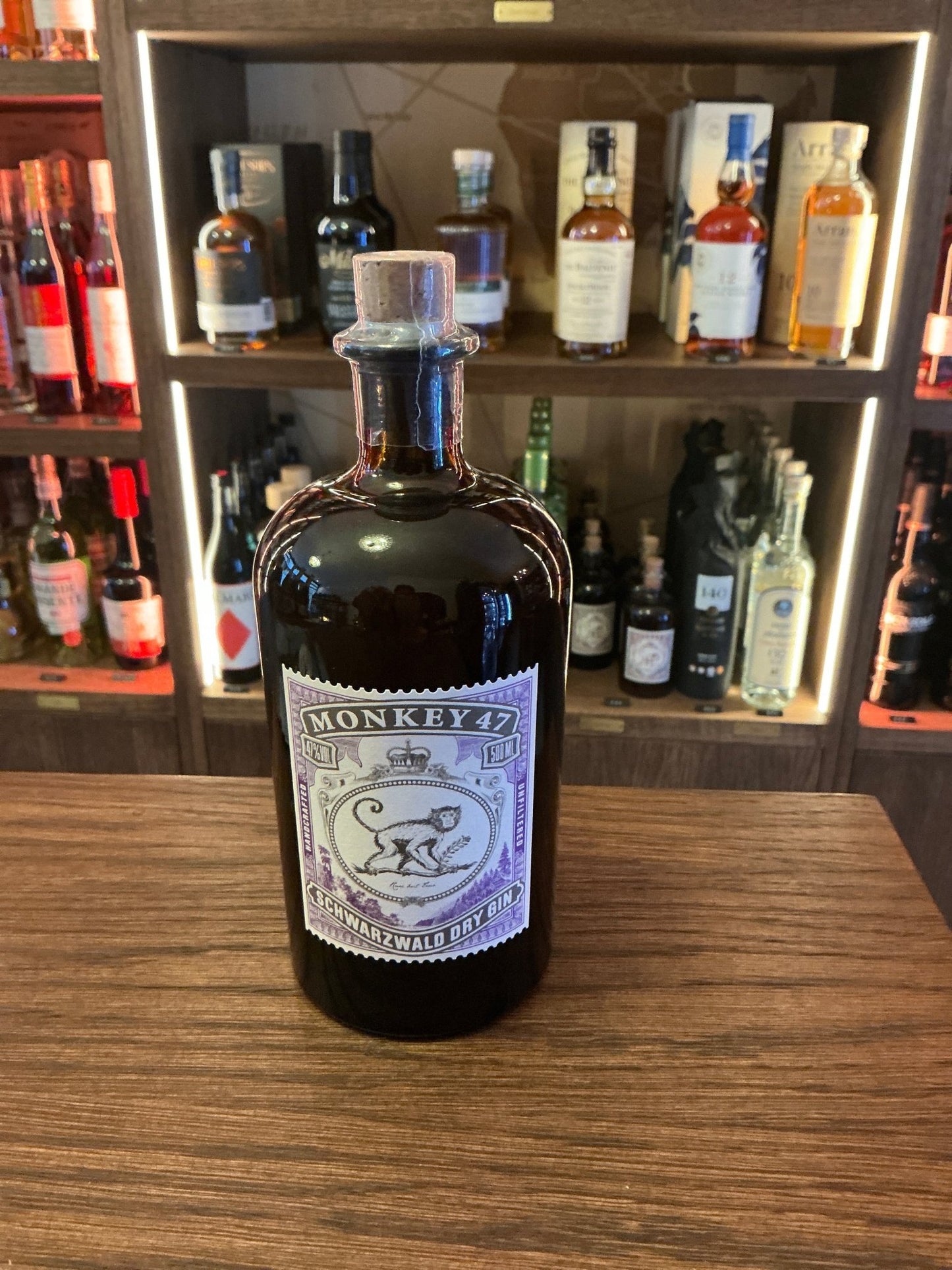 Monkey 47 premium German gin in dark glass bottle with botanical label, artisan small batch distilled gin.