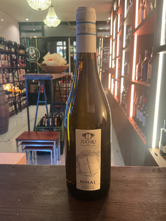 Nihal Grillo Sicilian white wine bottle with minimalist cream label, premium artisan craft bottled wine.