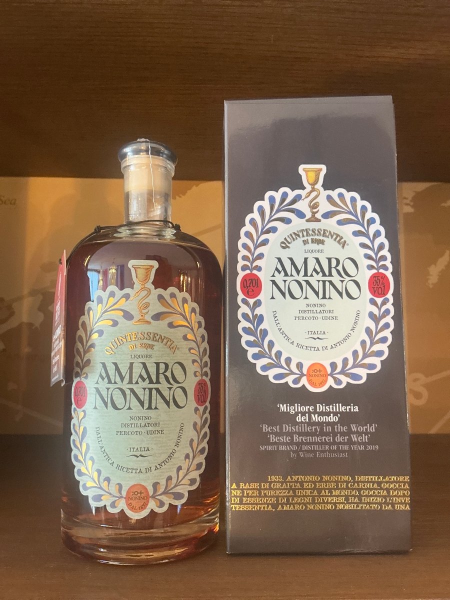Amaro Nonino Quintessentia 700ml apothecary-style bottle with illustrated navy blue gift box — Friuli Italian herbal amaro on ÙE® grape distillate, 35% ABV