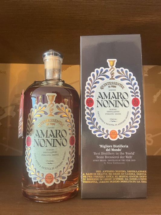 Amaro Nonino Quintessentia 700ml apothecary-style bottle with illustrated navy blue gift box — Friuli Italian herbal amaro on ÙE® grape distillate, 35% ABV