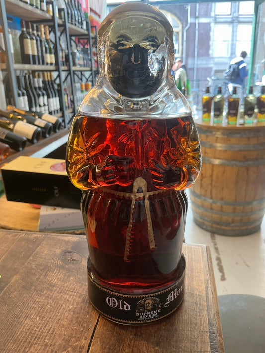 Limited edition Old Monk Supreme XXX Rum in a craft artisanal bottle shaped like a monk, rich dark rum with premium aged.