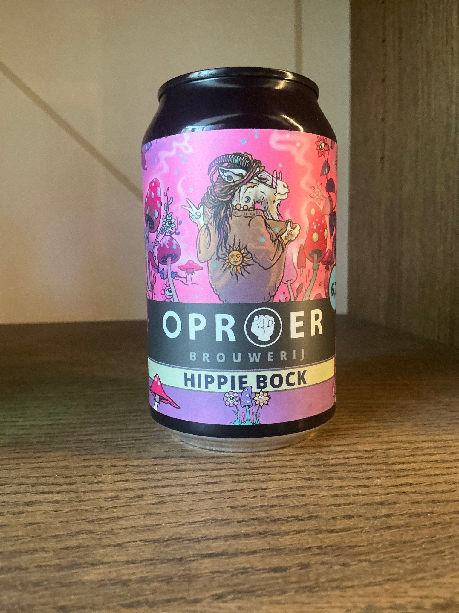 Oproer Hippie Bock premium craft beer can with pink label featuring artisanal Dutch design and limited edition branding on.