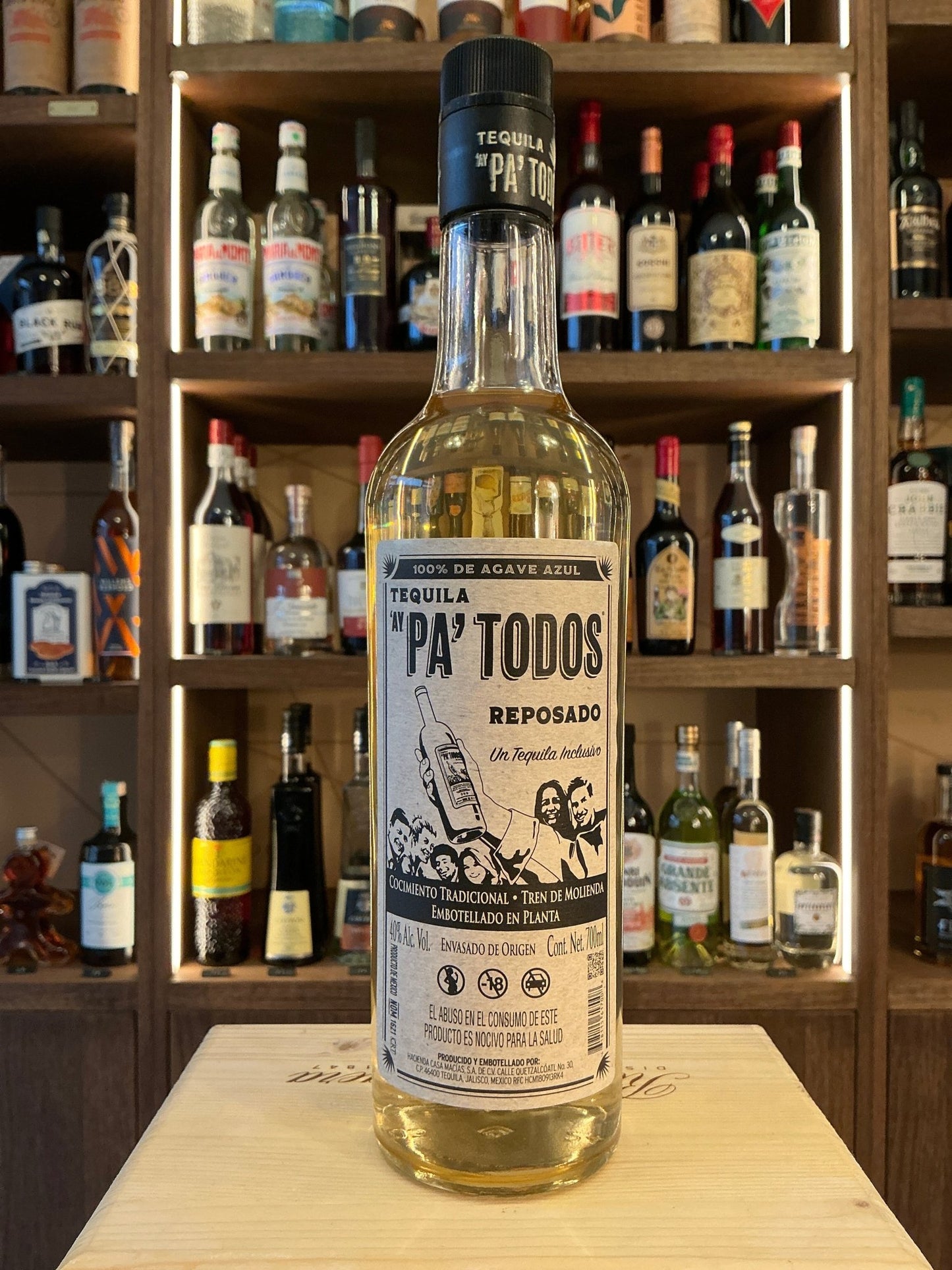 Pa’Todos Reposado premium tequila bottle with aged, distilled artisan spirit in clear glass and detailed black-and-white.