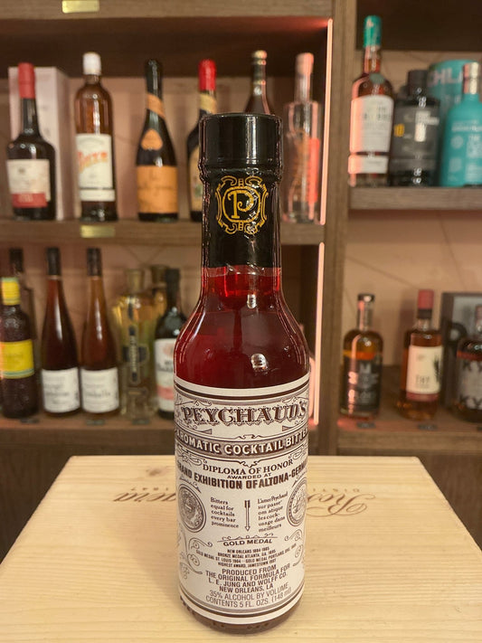 Peychaud’s Bitters bottle with deep red liquid, botanical spiced artisan label, premium small batch specialty spirits for.