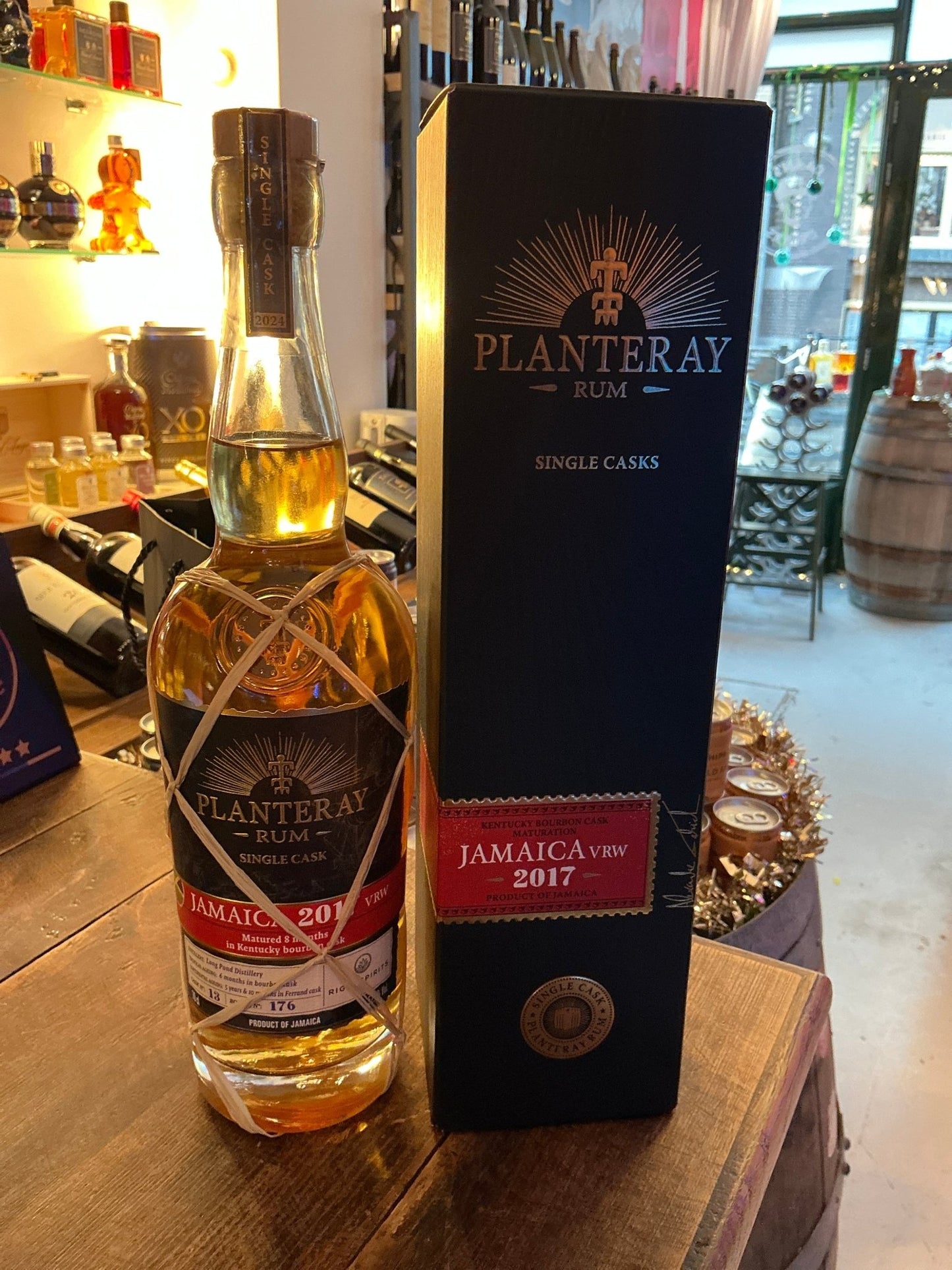 Planteray Rum Jamaica VRW 2017 aged rum bottle with intricate woven label, next to black premium box highlighting small.
