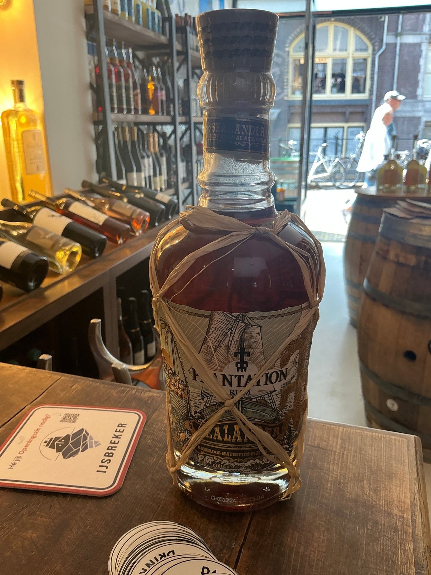 Planteray Sealander Aged Rum bottle in artisan netting — triple-origin blended rum from Barbados, Mauritius & Fiji, finished in cognac casks