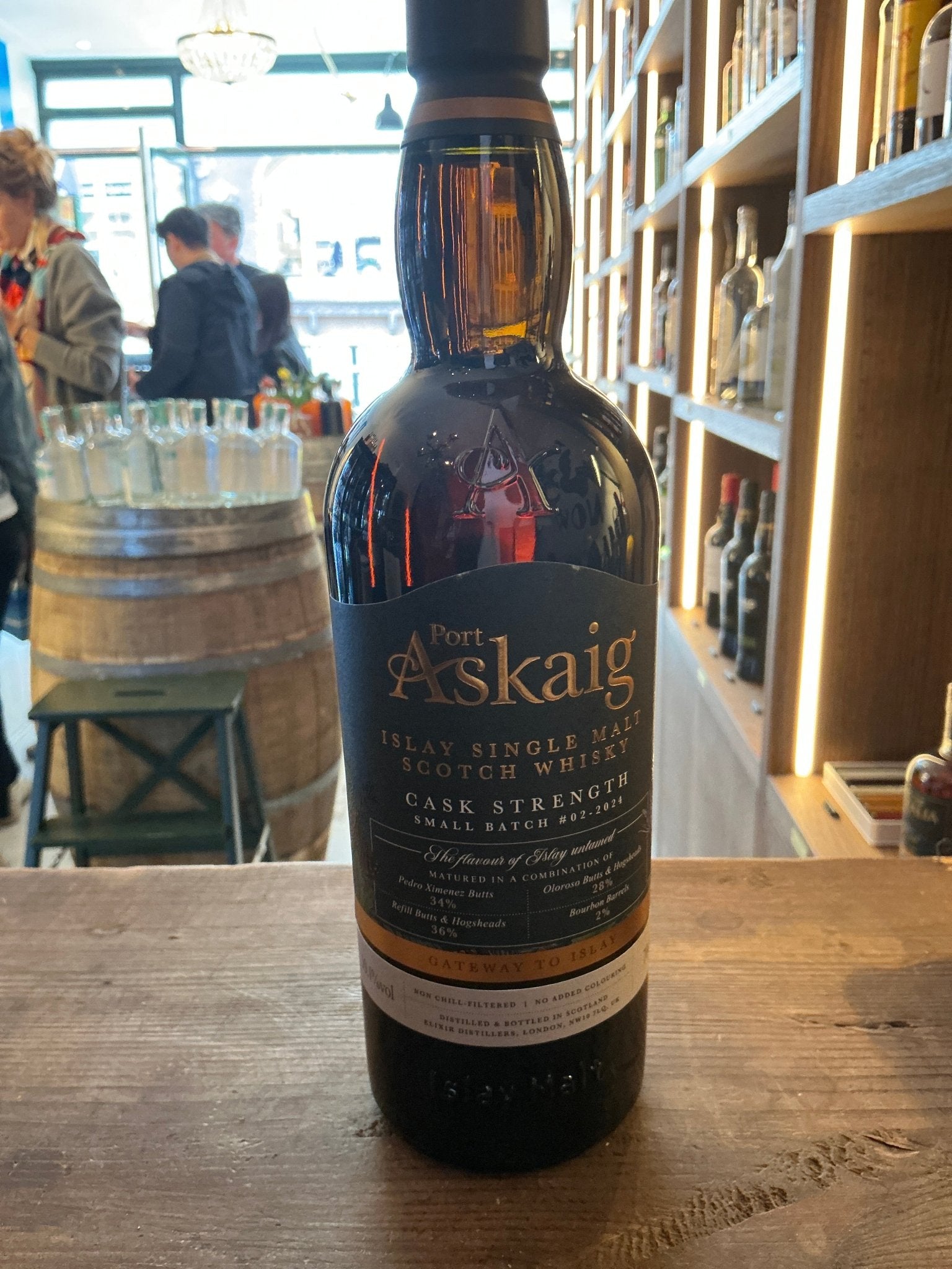 Port Askaig Cask Strength single malt whisky bottle with dark amber liquid, premium aged artisan spirit, small batch.
