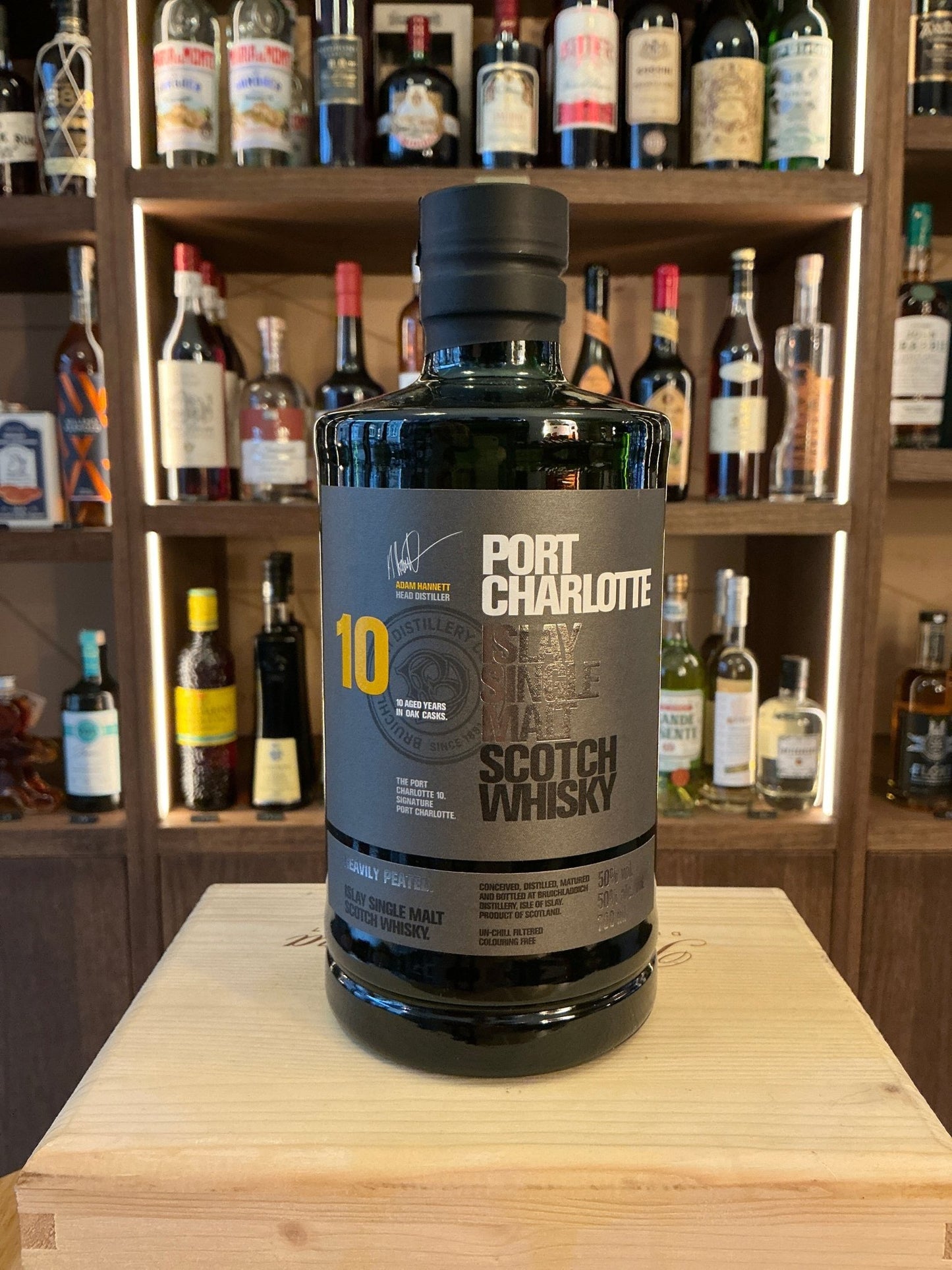 Port Charlotte 10 Year single malt whisky bottle with dark glass, premium aged Scotch whisky, bold botanical and spiced.