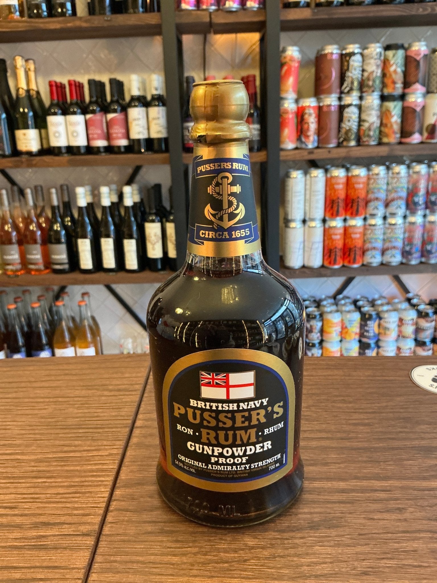 Pusser's Rum Gunpowder Proof bottle with black and gold label, artisan British navy rum, small batch, premium spiced rum,.