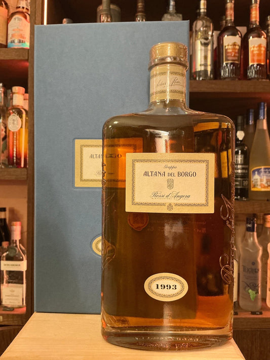 Rossi D’Angera Altana Del Borgo 1993 aged brandy bottle with golden amber liquid, premium artisan packaging, small batch.