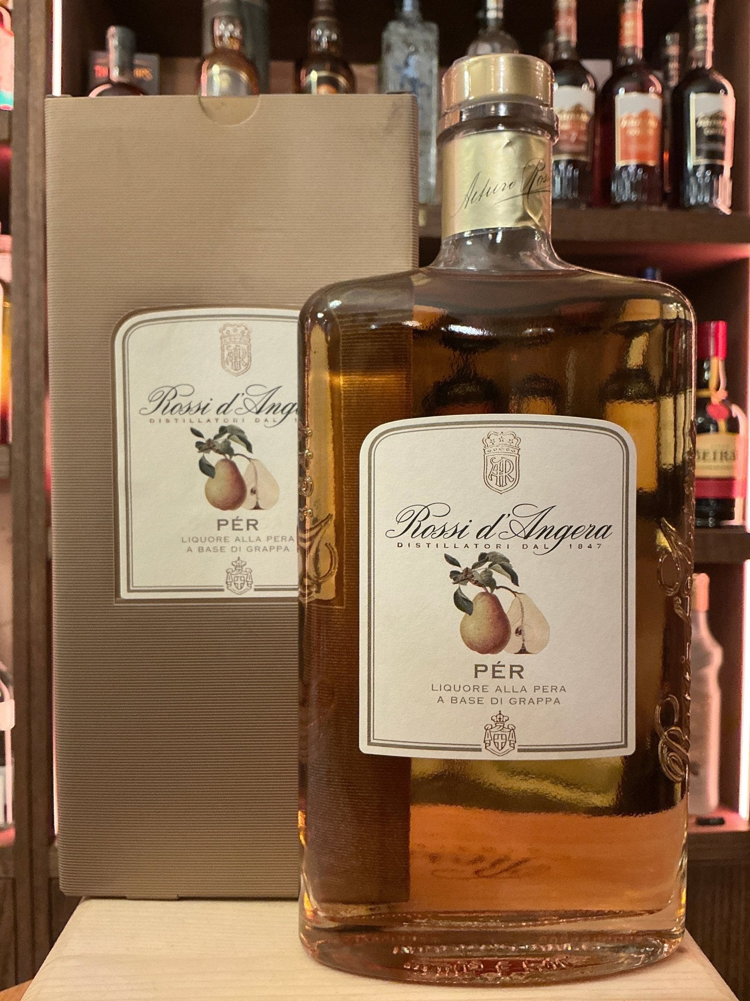 Rossi D’Angera Per pomace brandy bottle with amber liquid and beige label, artisan premium small batch spirit.