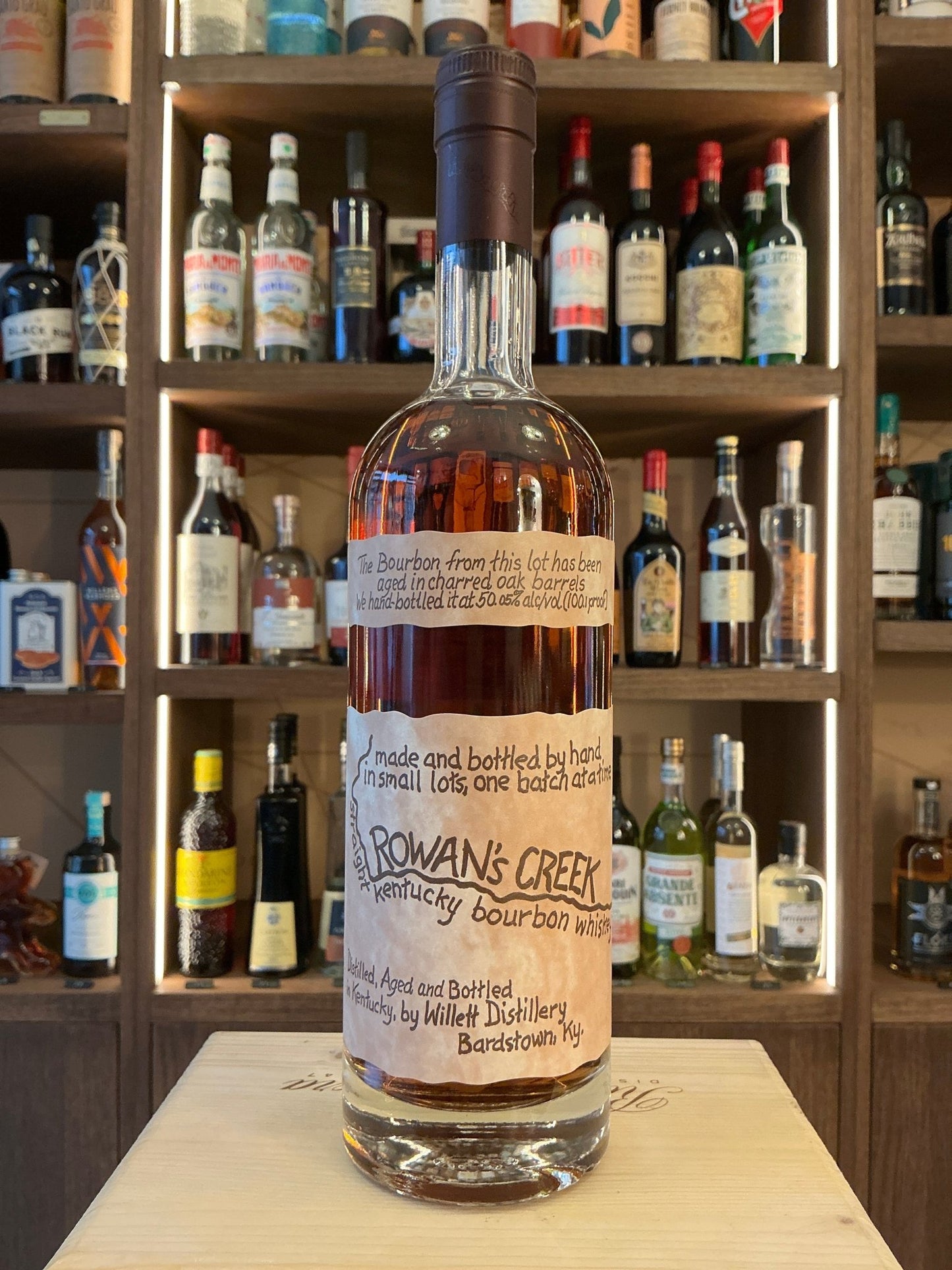 Rowan's Creek small batch Kentucky bourbon bottle with premium aged spiced flavor, artisan distilled bourbon.
