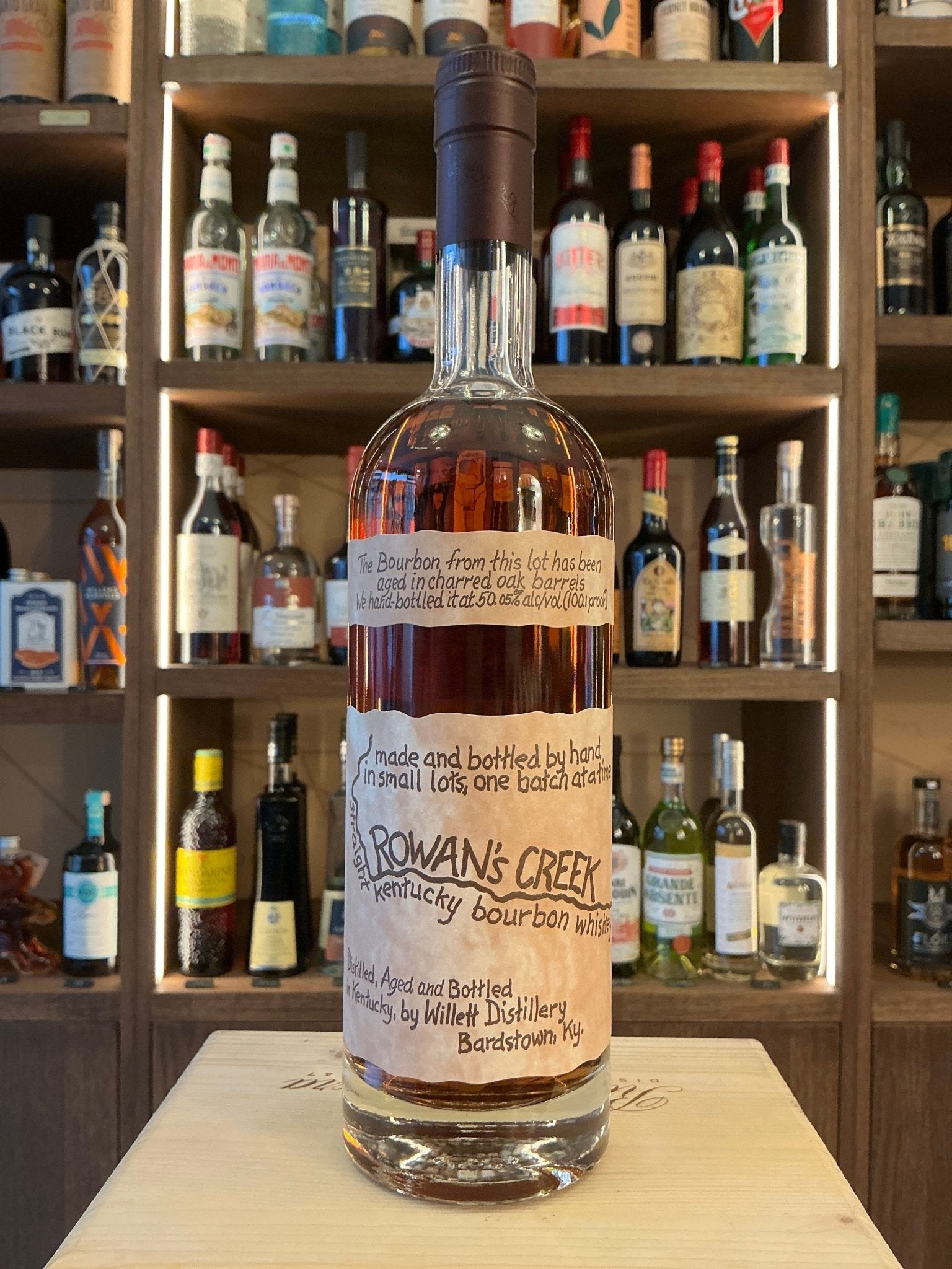 Rowan's Creek small batch Kentucky bourbon bottle with premium aged spiced flavor, artisan distilled bourbon.