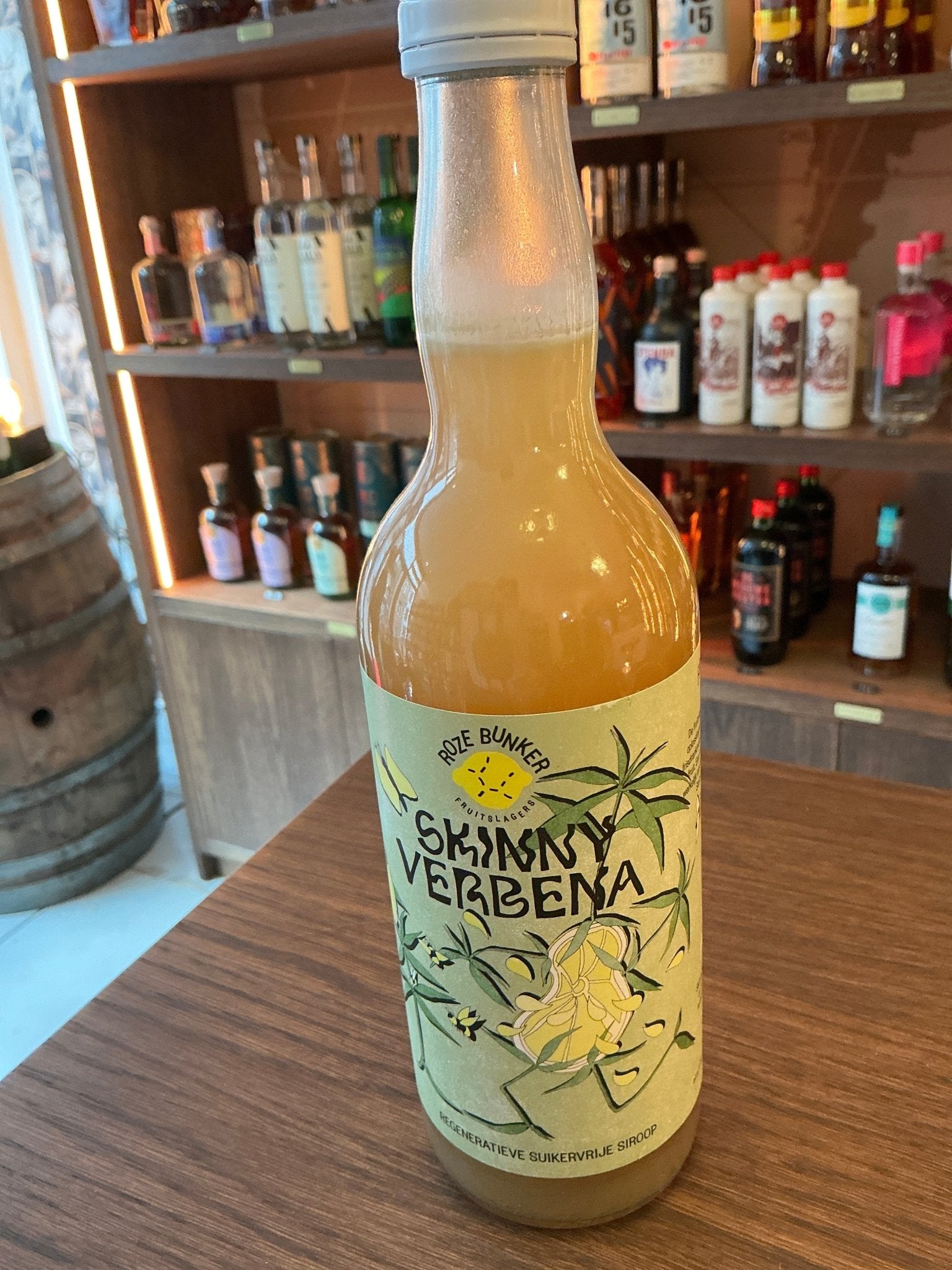 Roze Bunker Skinny Verbena cordial bottle with botanical illustrations on label, artisan Dutch specialty spirit.