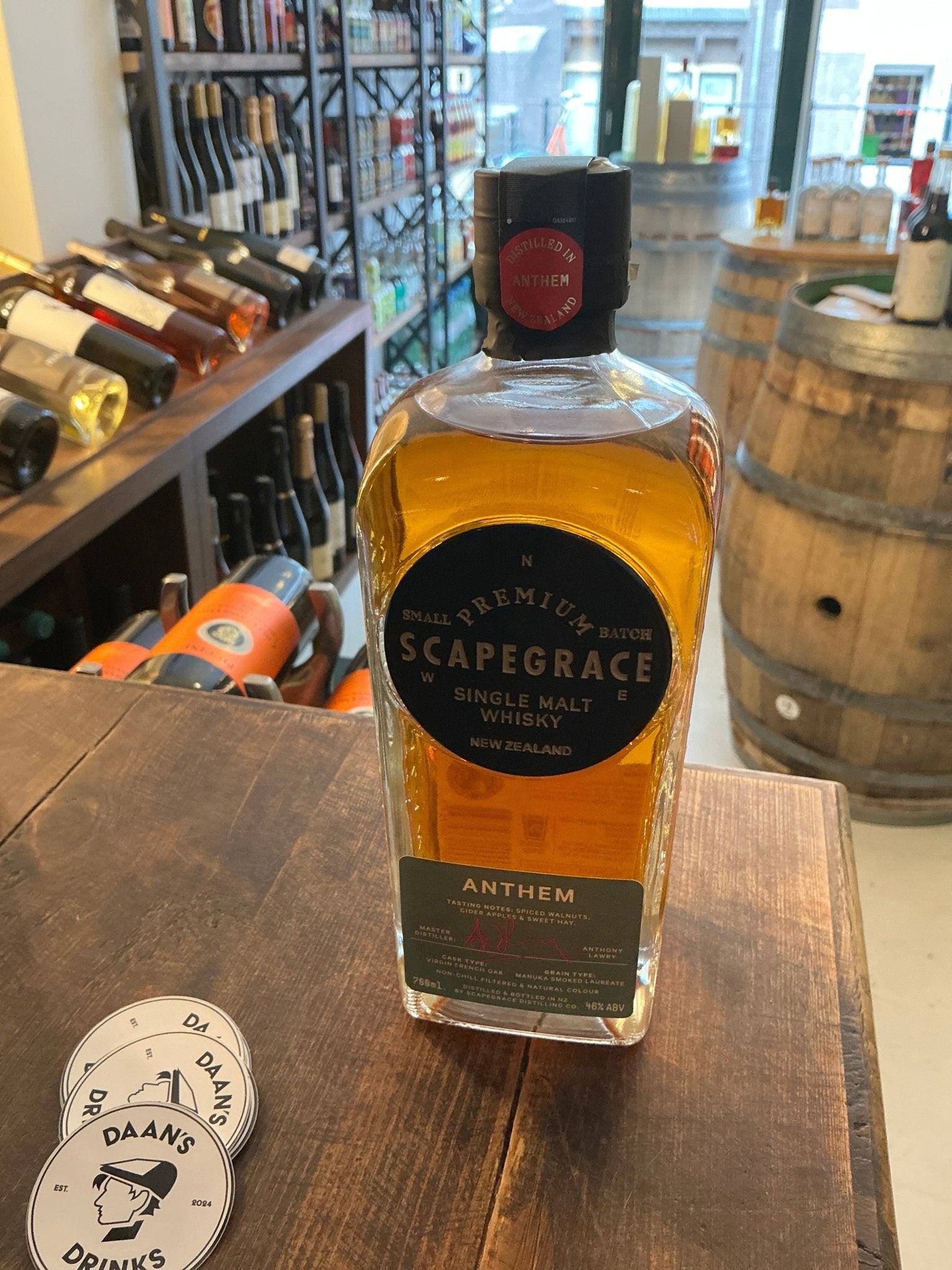 Scapegrace Anthem Single Malt whisky bottle with amber liquid, black label, and red wax seal, artisan New Zealand craft.