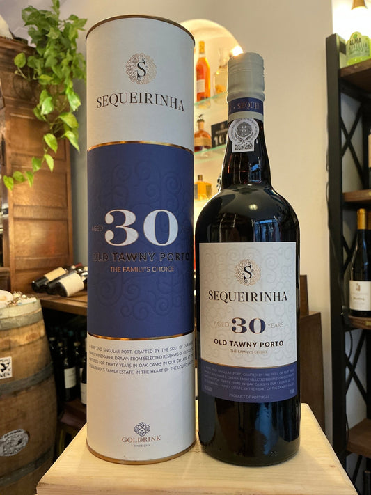 Sequeirinha 30-year-old tawny port in dark glass bottle with blue and white label and matching cylindrical box, premium aged .