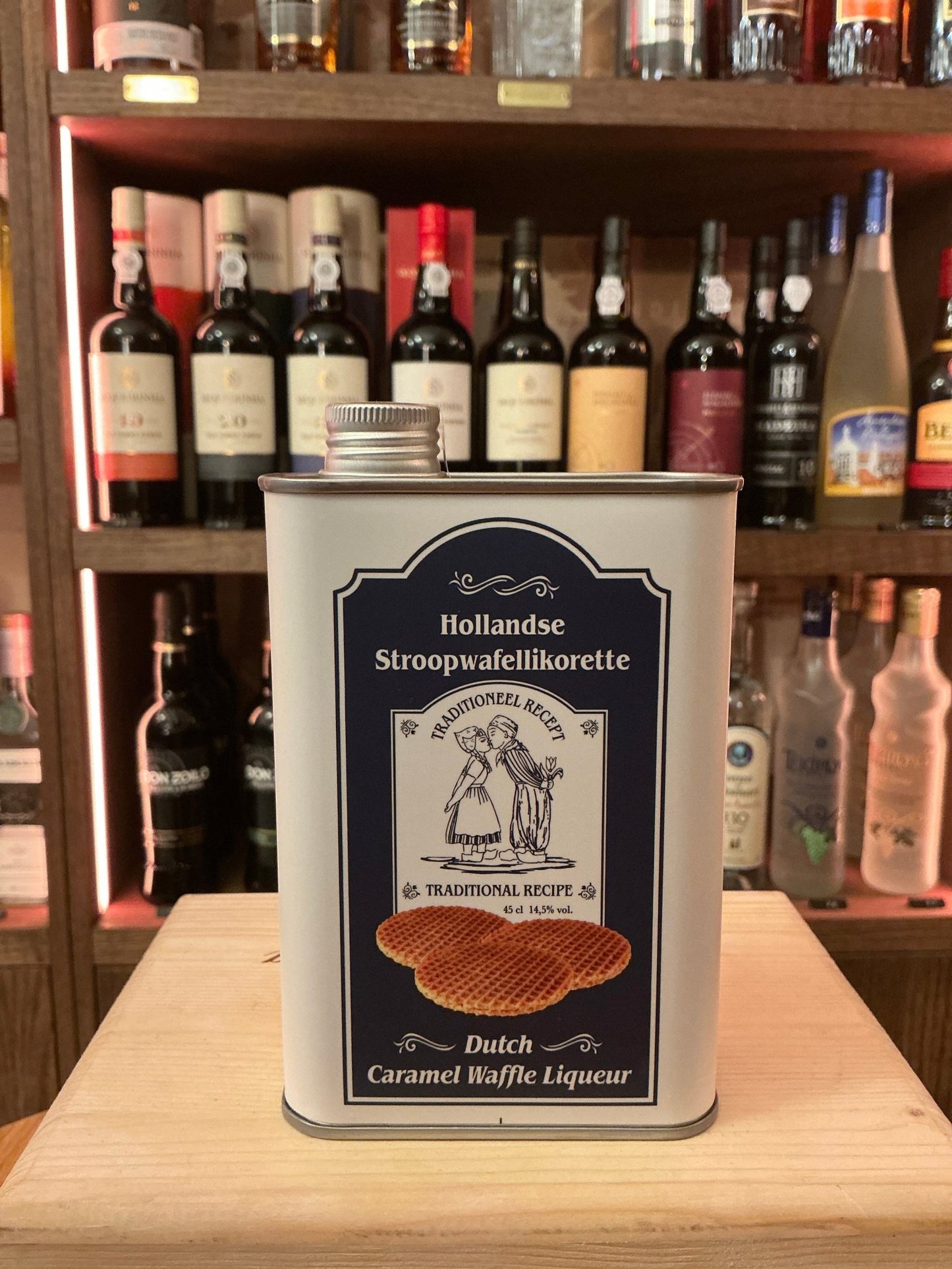 Rectangular metal tin of Hollandse Stroopwafellikeur Dutch caramel waffle liqueur, labeled artisan spiced premium specialty.