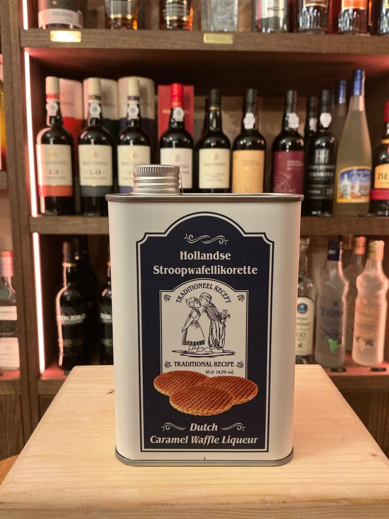 Rectangular metal tin of Hollandse Stroopwafellikeur Dutch caramel waffle liqueur, labeled artisan spiced premium specialty.