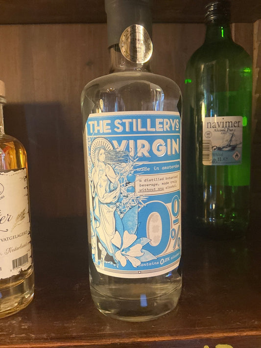 Clear glass bottle of The Stillerys Virgin non-alcoholic gin with blue and white label featuring botanical illustrations and .