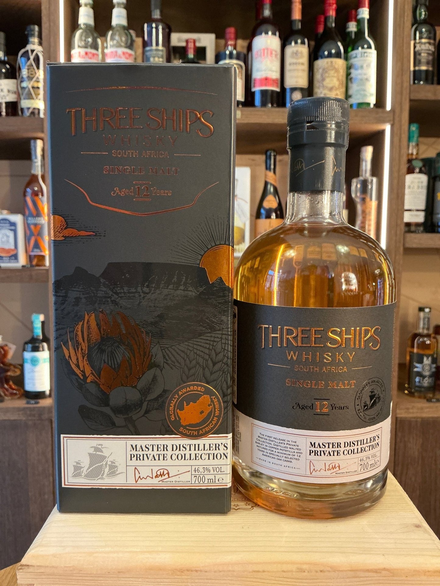 Three Ships 12 Year Single Malt Whisky bottle with amber liquid and black label highlighting aged, artisanal South African.