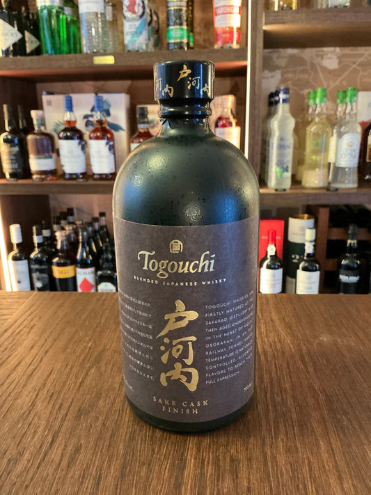 Matte black bottle of Togouchi Sake Cask Finish Japanese whisky with gold lettering, premium small batch artisan spirit on.