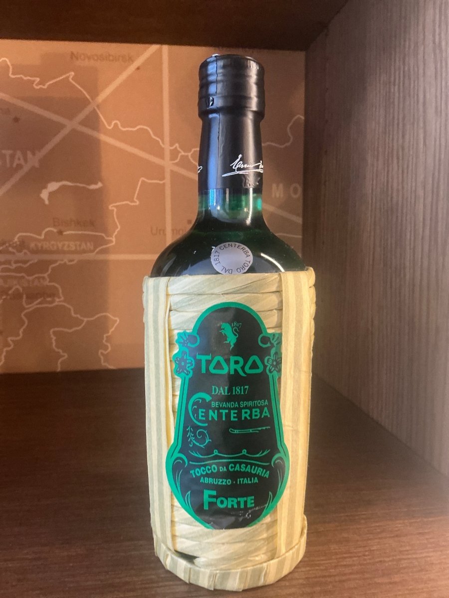 Toro Centerba Forte 700ml bottle in traditional wicker basket — Italian herbal liqueur from Abruzzo, Dal 1817, 70% ABV