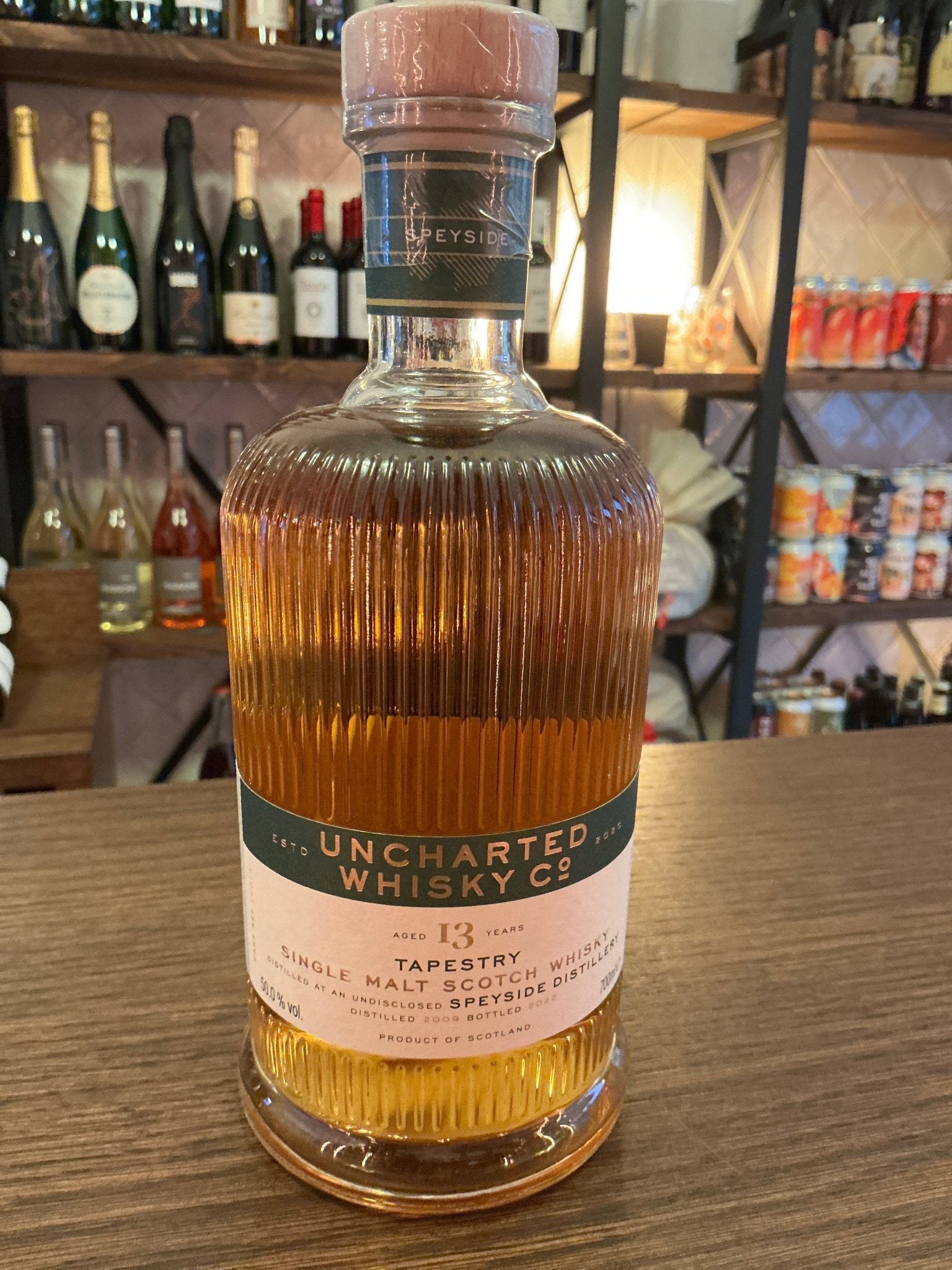 Uncharted Whisky Tapestry 13 Year Glen Elgin Single Malt bottle with ribbed glass and natural cork stopper, premium aged.