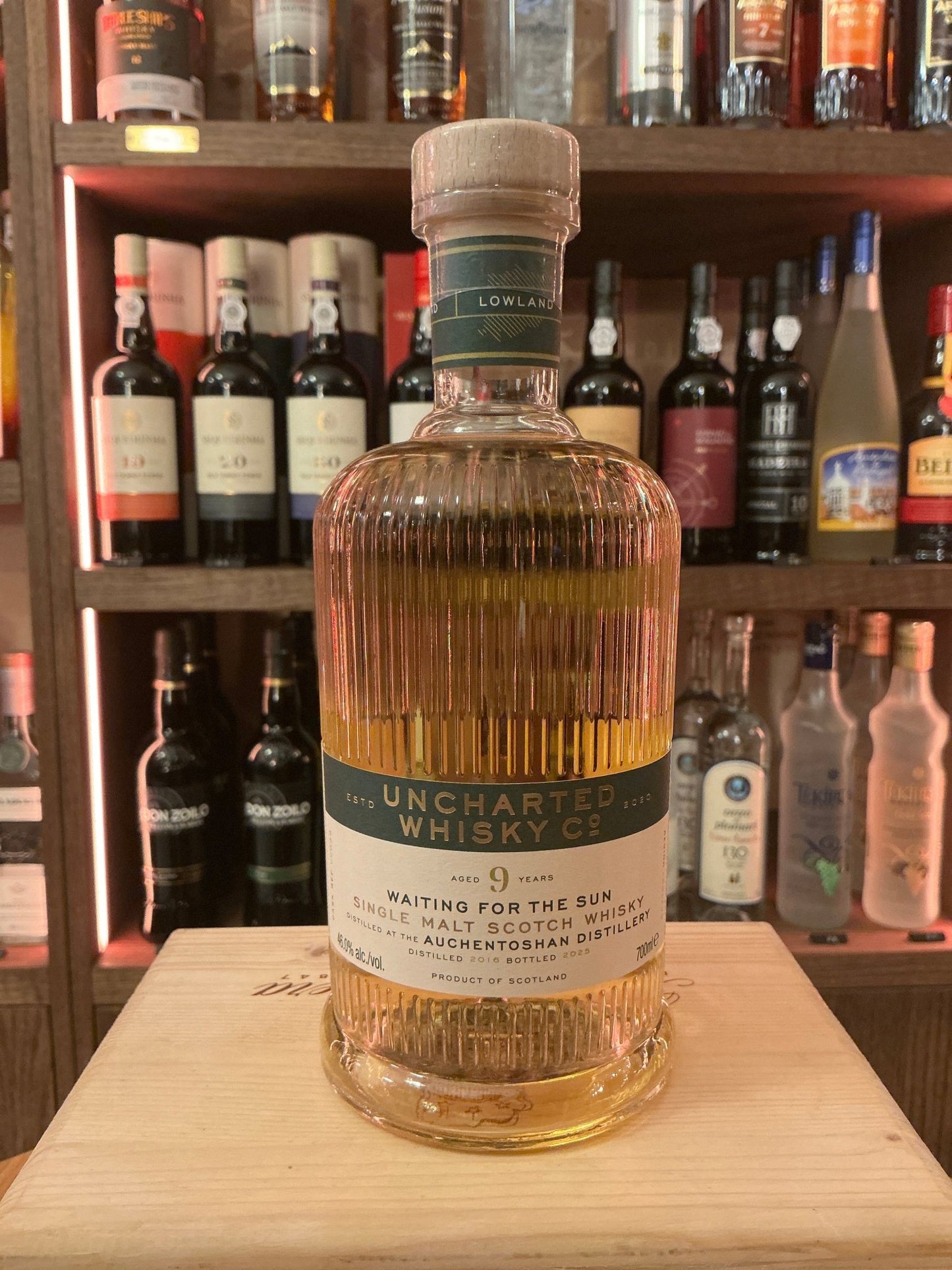 Uncharted Whisky Waiting for the Sun 9 Year Auchentoshan single malt Scotch whisky bottle with premium aged, distilled.