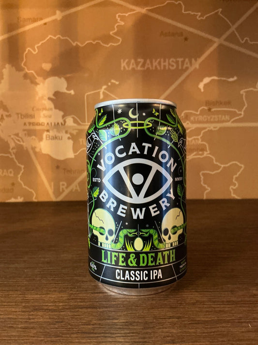 Black can of Vocation Brewery Life & Death Classic IPA with green skulls and neon accents, artisanal Dutch craft, limited.
